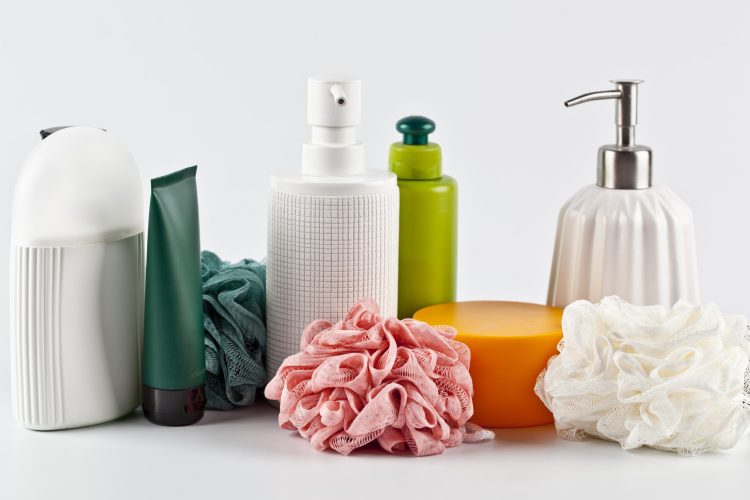 Bath cosmetic products set and sponges on light background. Bath cosmetic products set and sponges on light background. Bathroom body care consept.